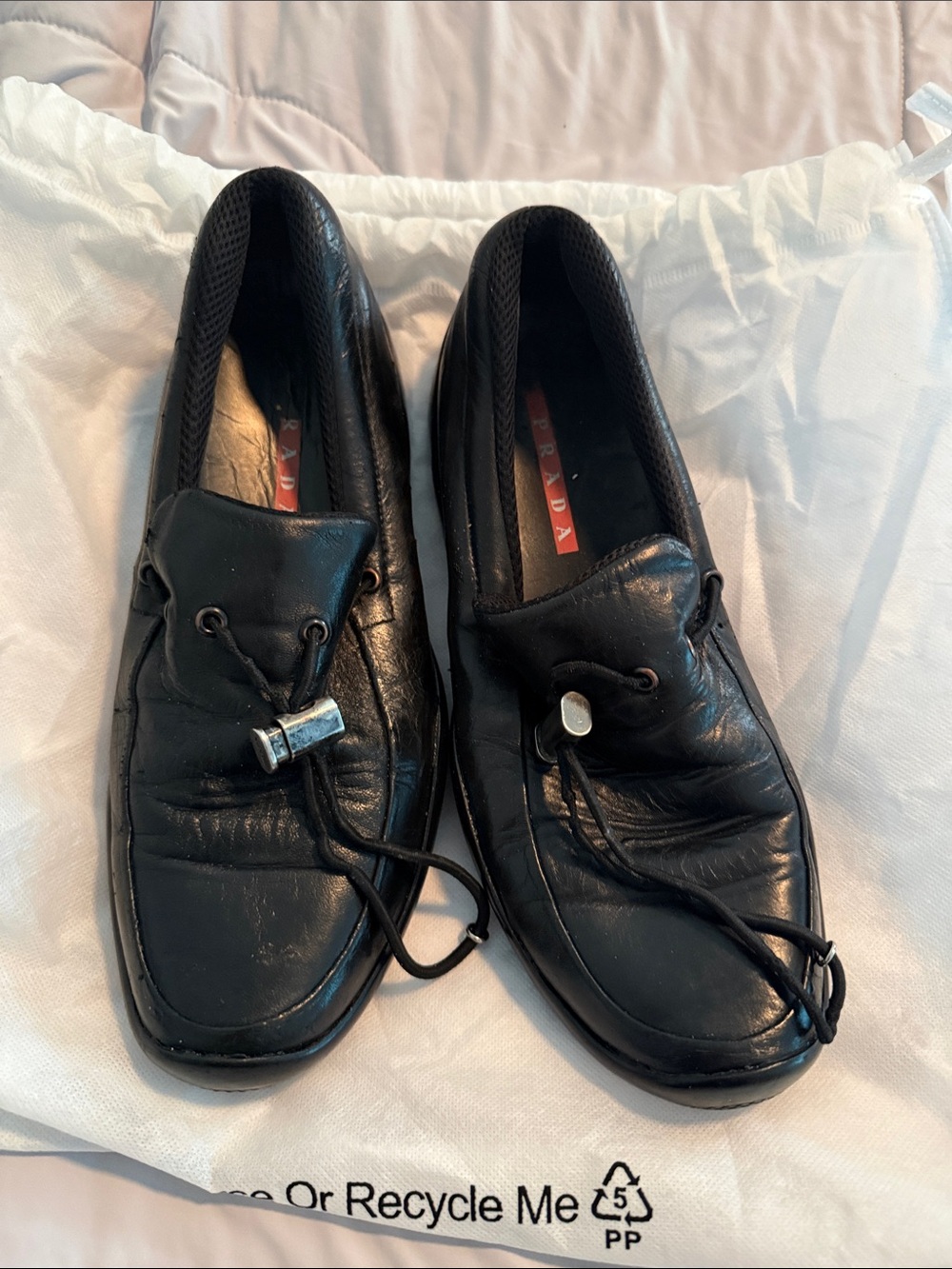 Prada Black Leather Men’s Slip-On Loafers with Toggle Detail